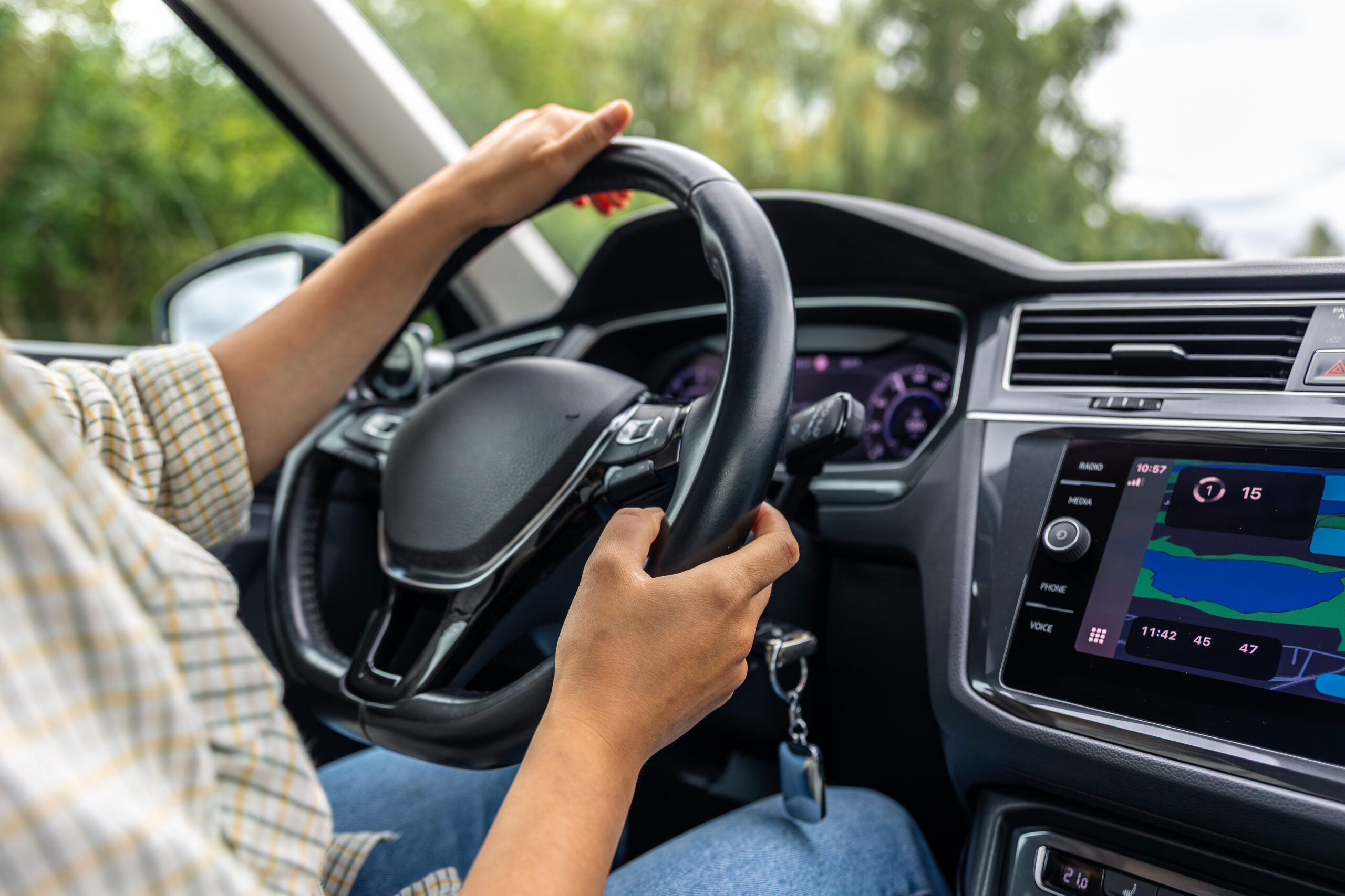 female-driver-car-wheel-navigation-display-modern-vehicle-interior